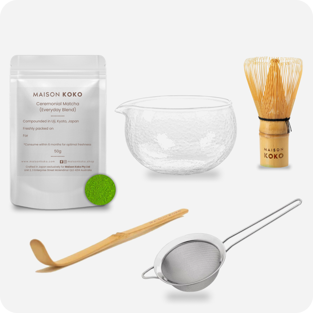 Maison Koko matcha preparation set with packaging, bowl, whisk, spoon, and sieve on a white background